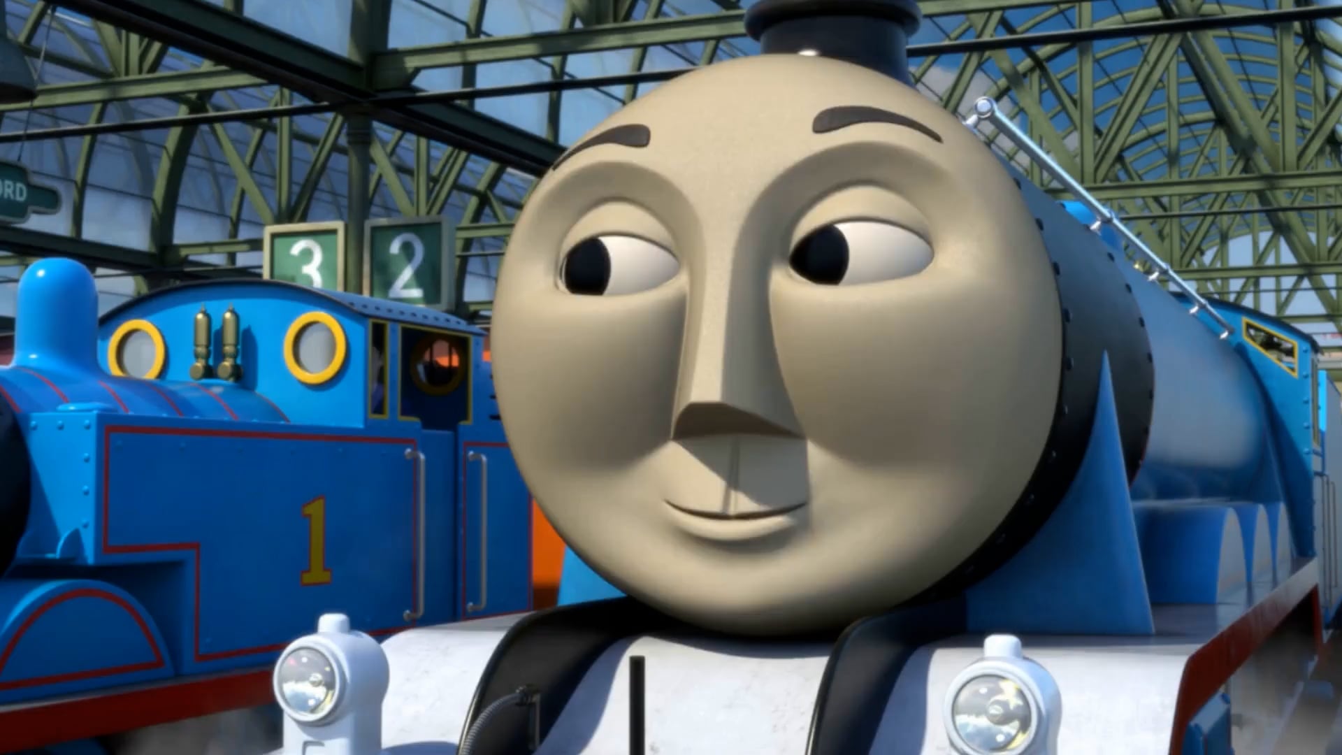 A train's face from Thomas and Friends, looking at another train to the left.